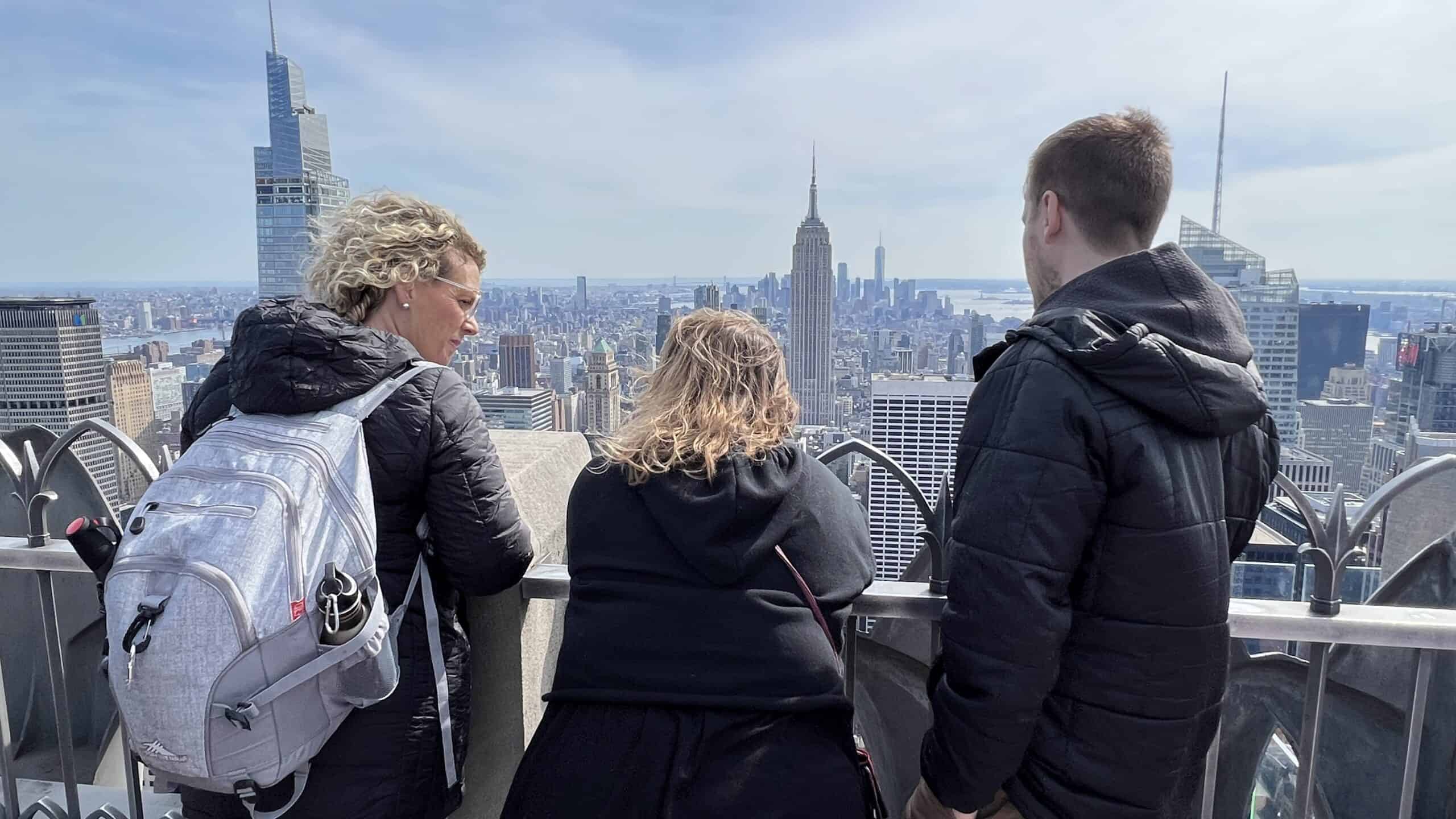 Fleurty Girl overlooking NYC with a High Sierra backpack