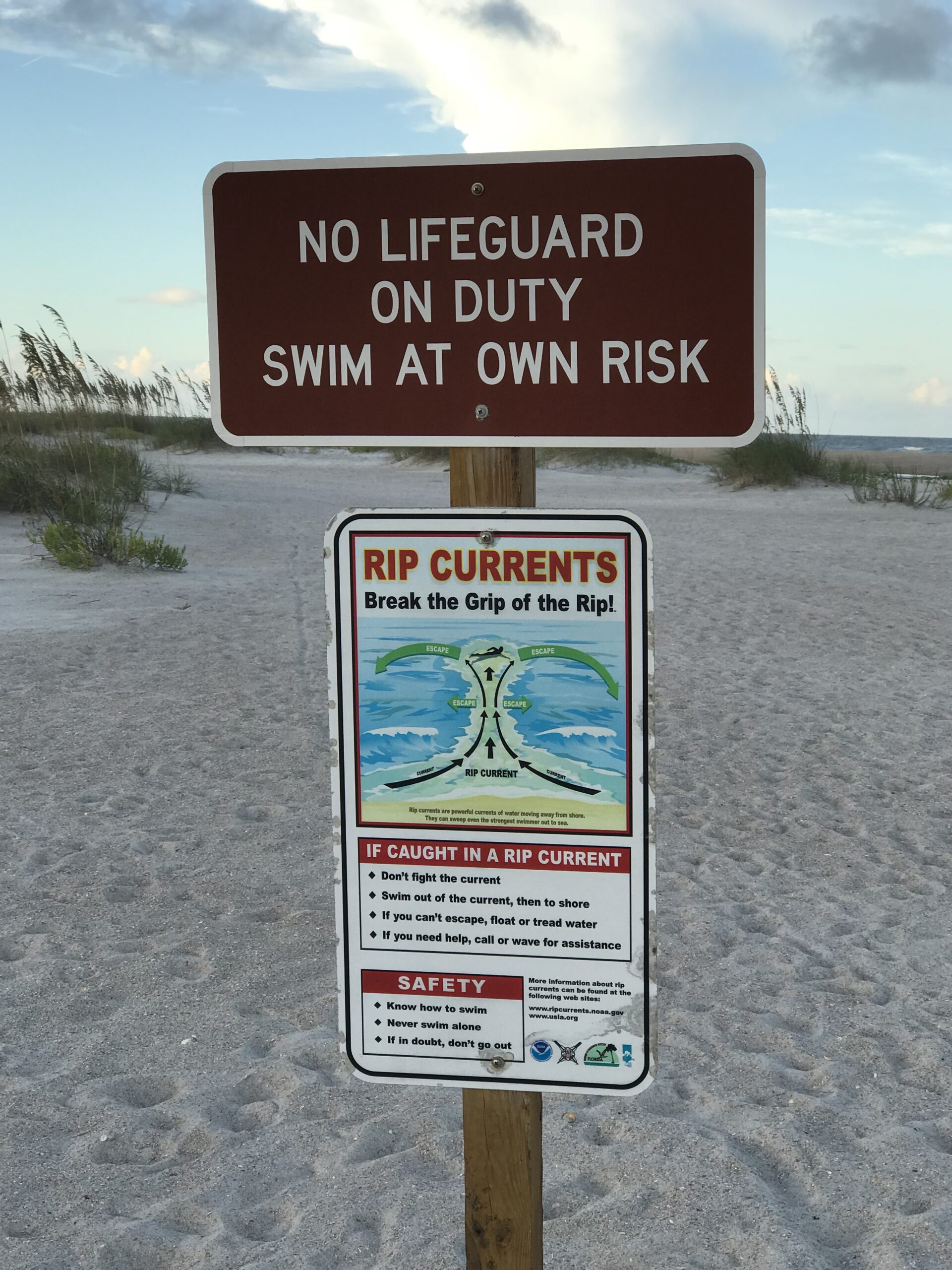 Rip tide warning sign on the beach