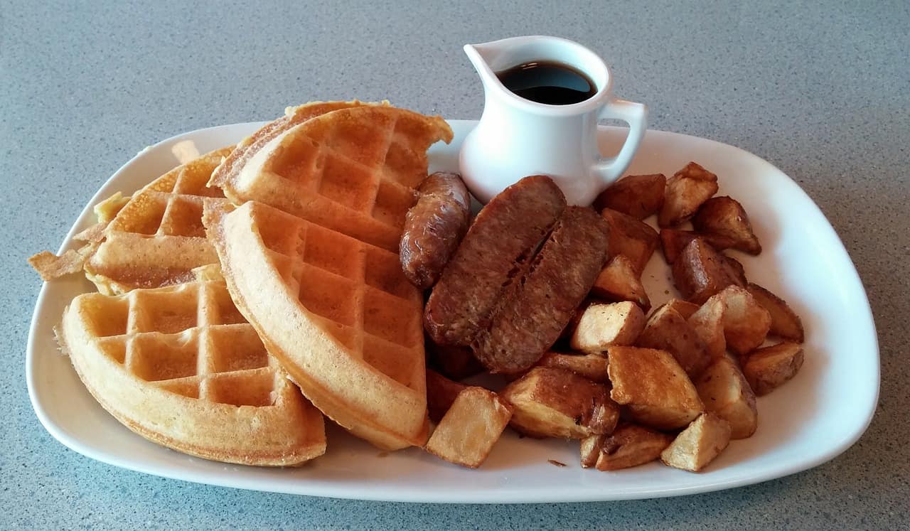 Waffle and sausage breakfast plate. 